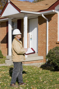 Home inspector looking for possible problems for a potential buyer, looking for needed repairs